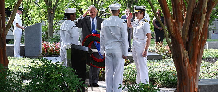 Office of Naval Intelligence (ONI) Commander Rear Adm. Kelly Aeschbach and retired Capt. Tom Bortmes lay a memorial wreath during a Sept. 11 remembrance ceremony at the National Maritime Intelligence Center. 